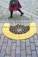 Sewer manhole on a city road.
