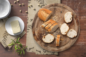 Fototapeta na wymiar A bread in cooking table background. Food set concept.