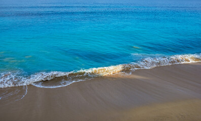 Bali island landscape. Seascape with waves, azure water at beautiful hidden white sand. Bali sea beach nature, outdoor Indonesia. Bali island landscape. Summer holidays. Travel, vacation concept.