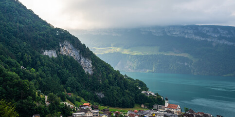 View of Lake Lucerne with Gersau town and Swiss Alps in the background. Canton of Schwyz, Switzerland.