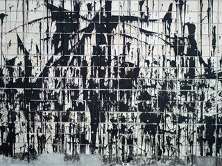 Texture of a white wall in drips of black resin
