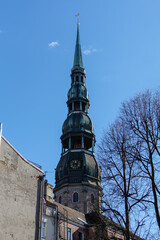 Obraz premium Tower of St. Peter’s Church with sphere and rooster atop the steeple. It is the tallest peak in Riga, and one of the oldest and most valuable monuments of medieval architecture in Baltic States.