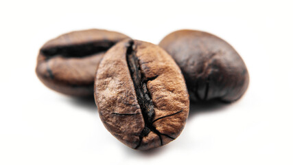 Macro Coffee beans on white background, roasted coffee beans isolated on white background. Close-up roasted coffee beans isolated on white background. Clipping path,with shadow