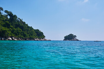 Fototapeta premium Turquoise sea, rain forest, rocks, ocean. Exploring tropical paradise island. Perfect getaway. Relaxing. Travel concept and idea. Beautiful azure ocean.