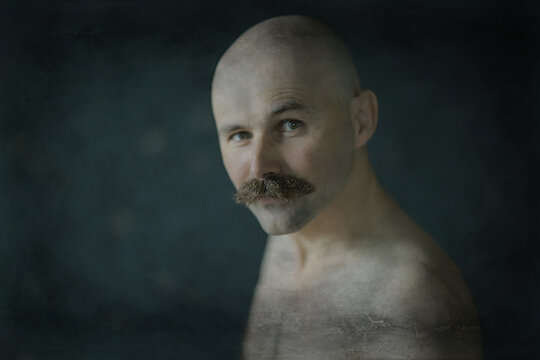 sexy macho with a mustache, freak, unusual portrait of a hipster guy