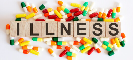 ILLNESS medicine words on the wooden block.Healthcare conceptual