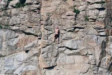 Guy's climbing rocks, extreme. Crested surface, in cracks. Rock. Stone walls. fearless person....