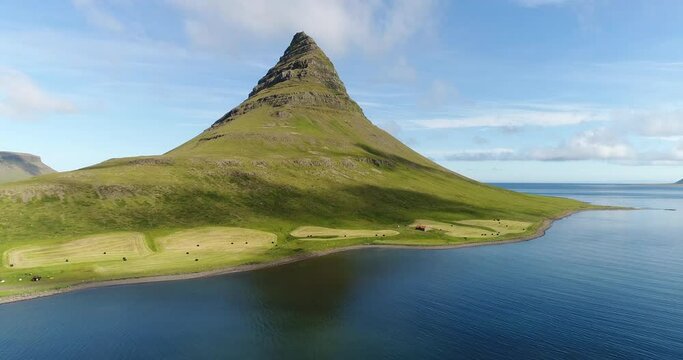 Iceland nature drone video of Kirkjufell mountain landscape in West Iceland on the Snaefellsnes peninsula. Icon of Iceland and most photographed mountain.