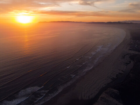 Aerial view of sunset over beach