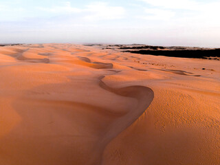 View of sand dunes during sunset