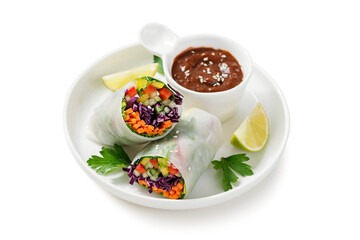 Vegetarian vietnamese spring rolls with peanut butter sauce, carrot, cucumber, red cabbage and rice...
