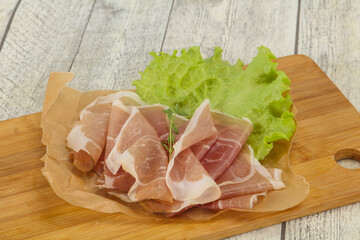 Italian prosciutto pork meat over board