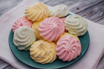 Colorful air marshmallows on a plate. Fresh homemade sweet marshmallows