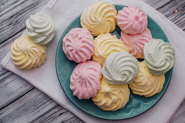 Colorful air marshmallows on a plate. Fresh homemade sweet marshmallows