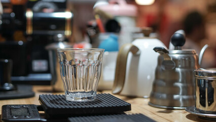empty glass cup for coffee, close up of coffee glass on black digital scales