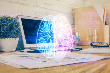 Double exposure of work space with computer and human brain drawing hologram. Brainstorm concept.