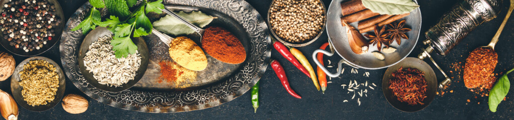 Herbs and spices on dark background