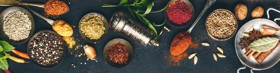 Herbs and spices on dark background