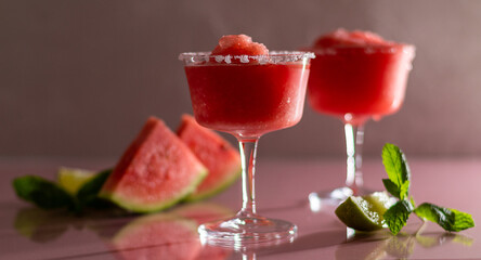 Refreshing summer frozen watermelon margaritas with lime and mint. 