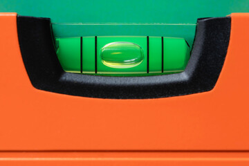 orange spirit level with green bubble