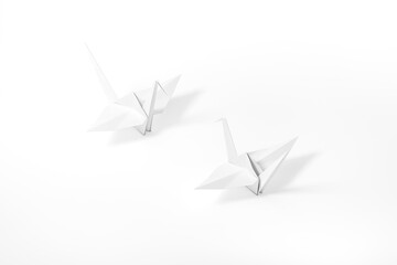 Fototapeta premium Origami Bird, bird paper crane on white background 3d rendering. 3d illustration pair of bird paper craft for Hiroshima remembrance day minimal style concept.