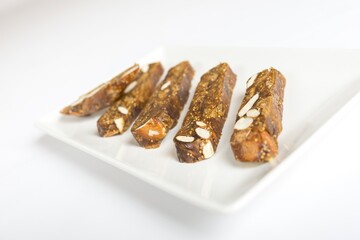 Closeup shot of pieces of biscotti with nuts on a white background