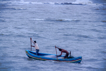 Two Fisherman in the boat in the arabian sea , Mumbai, India