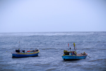 Naklejka na ściany i meble Two Boats in the arabian sea near mumbai, India