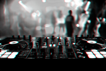 professional DJ mixer controller at a concert in a nightclub
