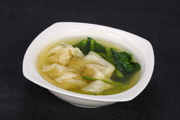 Asian traditional Wonton soup with herbs