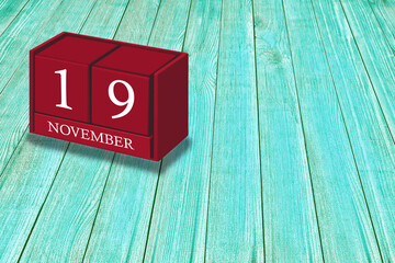 November 19th, Day 19 of November month, Red calendar on workplace green wood, Empty space for text, Copy space right, 3D illustration
