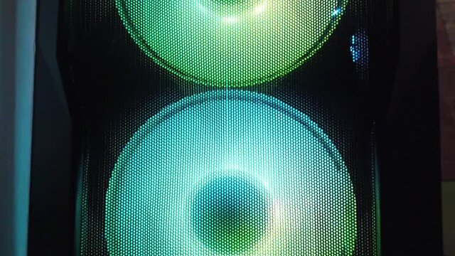 colorful computer cooling system fans rotating in round circle vertical shot background 