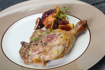 Roasted. duck. leg with plum and apple