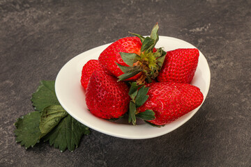 Ripe sweet strawberry with leaf