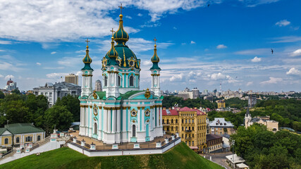 Aerial drone view of Saint Andrew's church and Andreevska street from above, cityscape of Podol...