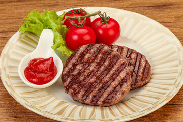 Grilled burger cutlet with sauce
