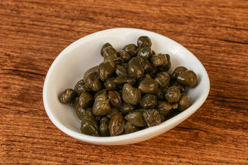 Tasty capers in the bowl