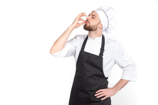 Endorsement of the quality of the food. A gesture of pleasure. The chef makes an approving gesture with his hand. The chef confirms the high quality of the dishes. Chef shows sign for delicious.