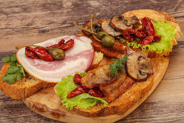 Italian appetizer - bruschetta mix with meat