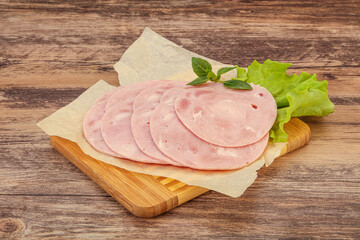 Slised ham snack over board