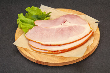 Sliced pork belly over board