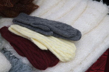 Fototapeta na wymiar Knitted wool mittens an scarfs