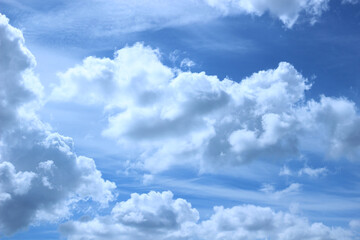 blue sky with white fluffy clouds