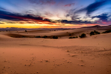 Dramatic and colorful sunset at The Sahara desert: Earth's Largest Hot Desert