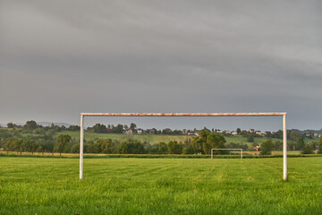 Closed soccer field at sunrise.