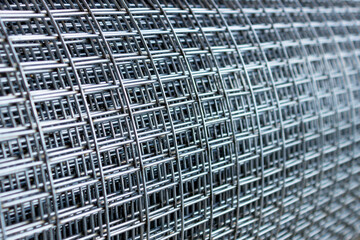  Roll of metal mesh with rectangular cells. Concept- construction, building materials. Selective...