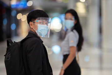 Fototapeta na wymiar Asian man wearing antivirus masks In the mall