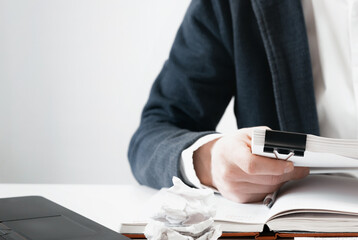 Cropped view of businessman works with financial papers at the table. Finance concept