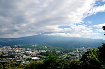 View towards cloud covered mount Fuji over Kawaguchi town, Japan