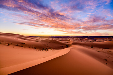 Fototapeta na wymiar Dramtic and colorful sunrise at the Sahara desert: Earth's Largest Hot Desert